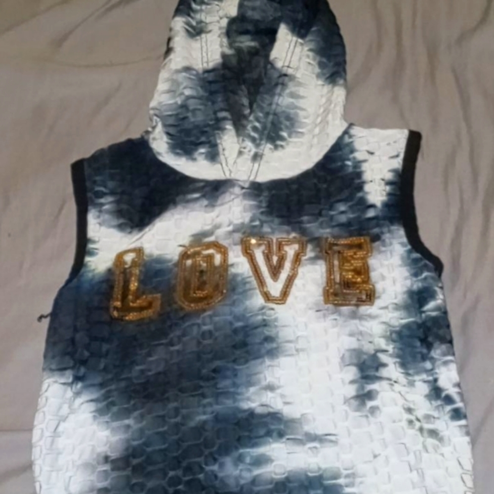 Black and white tee shirt with a hood